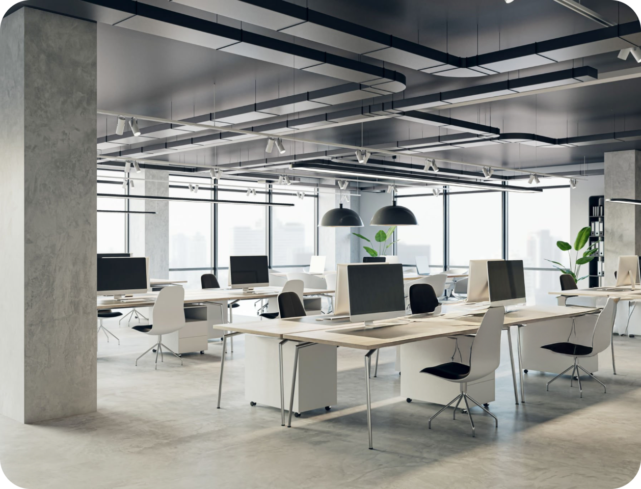 an office with a lot of desks and computers